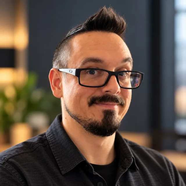 Michael Dunnam, the maker of Liminal, smiling in black glasses and a dark shirt